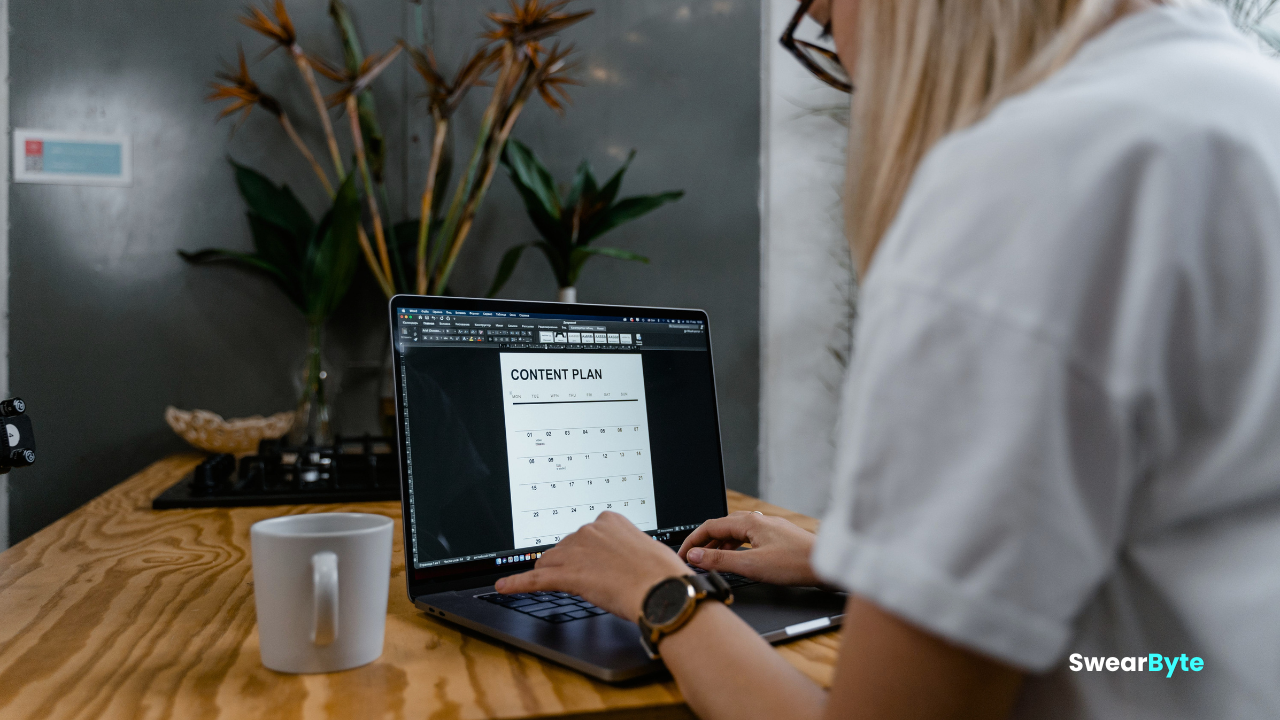 Content creator writing and planning blog content on a laptop
