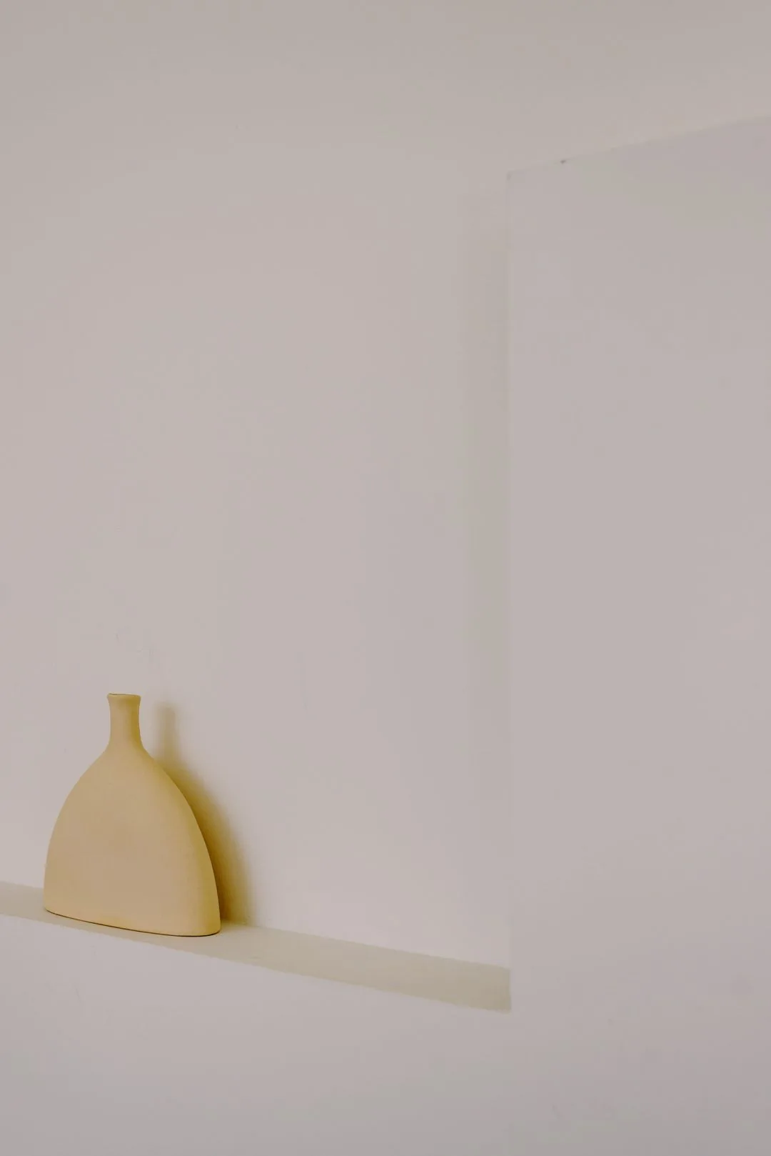 beige vase on shelf aesthetic phone wallpaper