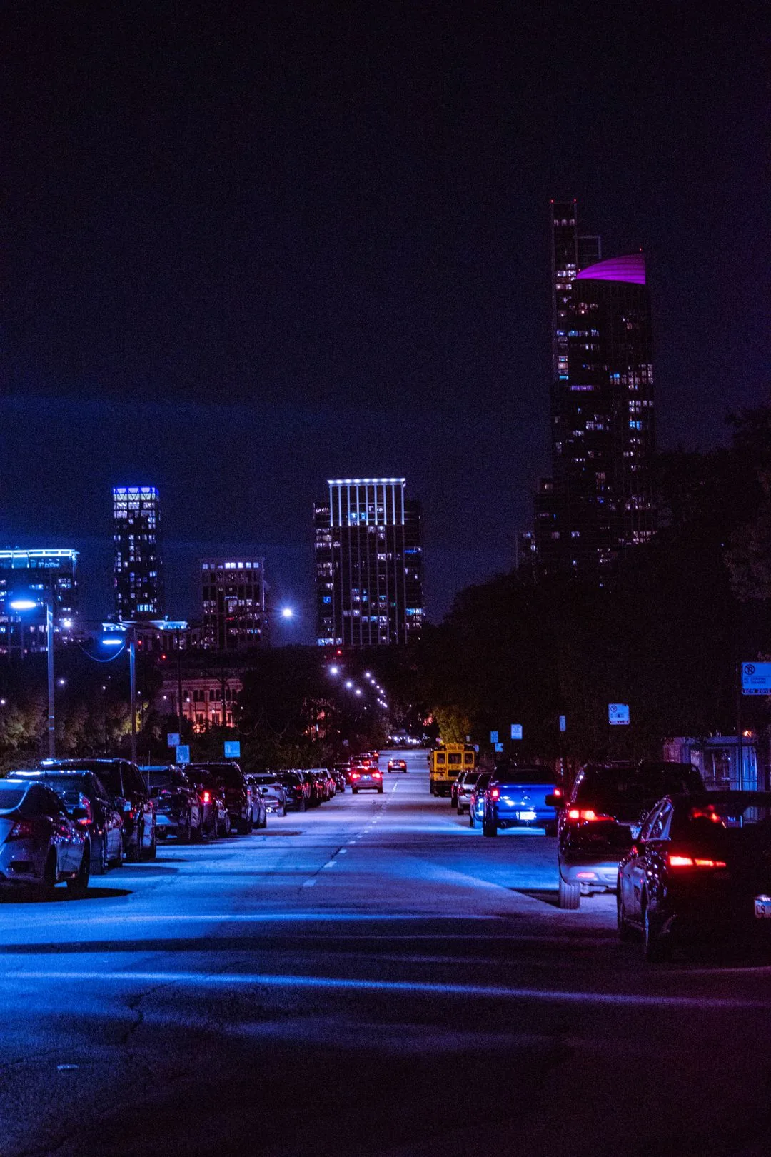 city street at night with skyscrapers aesthetic phone wallpaper