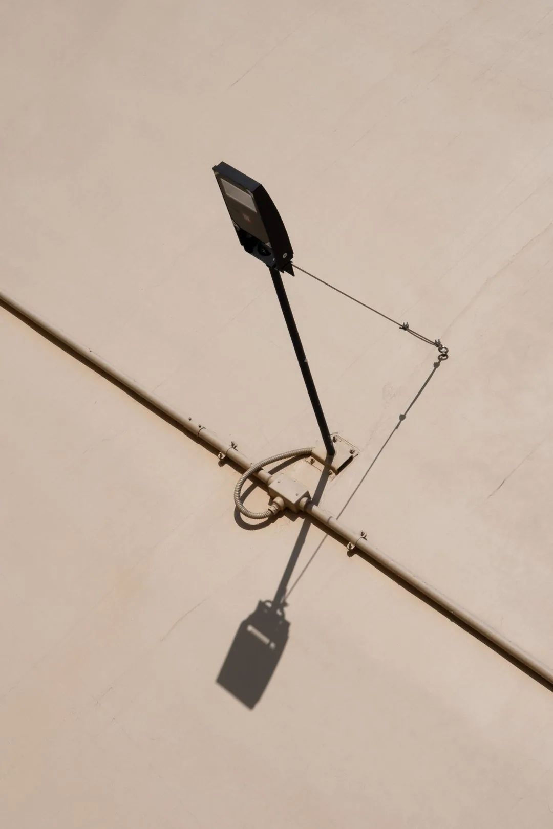 street light shadow on beige wall aesthetic phone background
