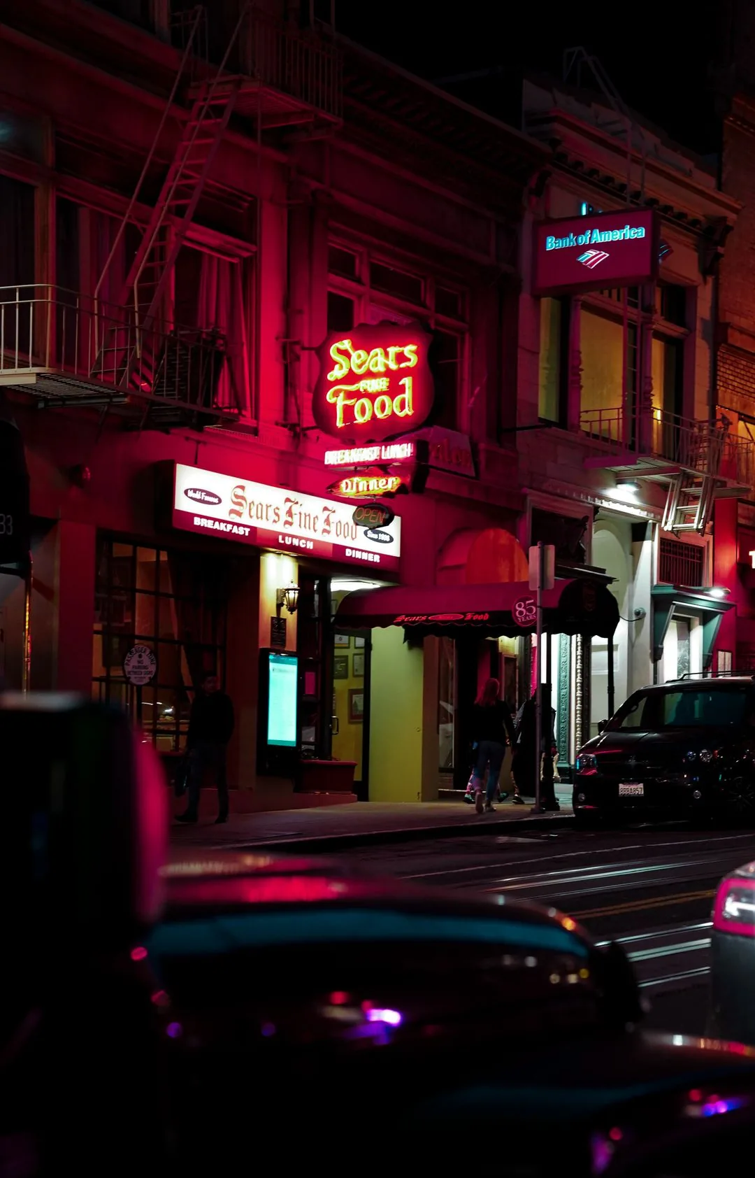 neon street with cars at night aesthetic phone wallpaper