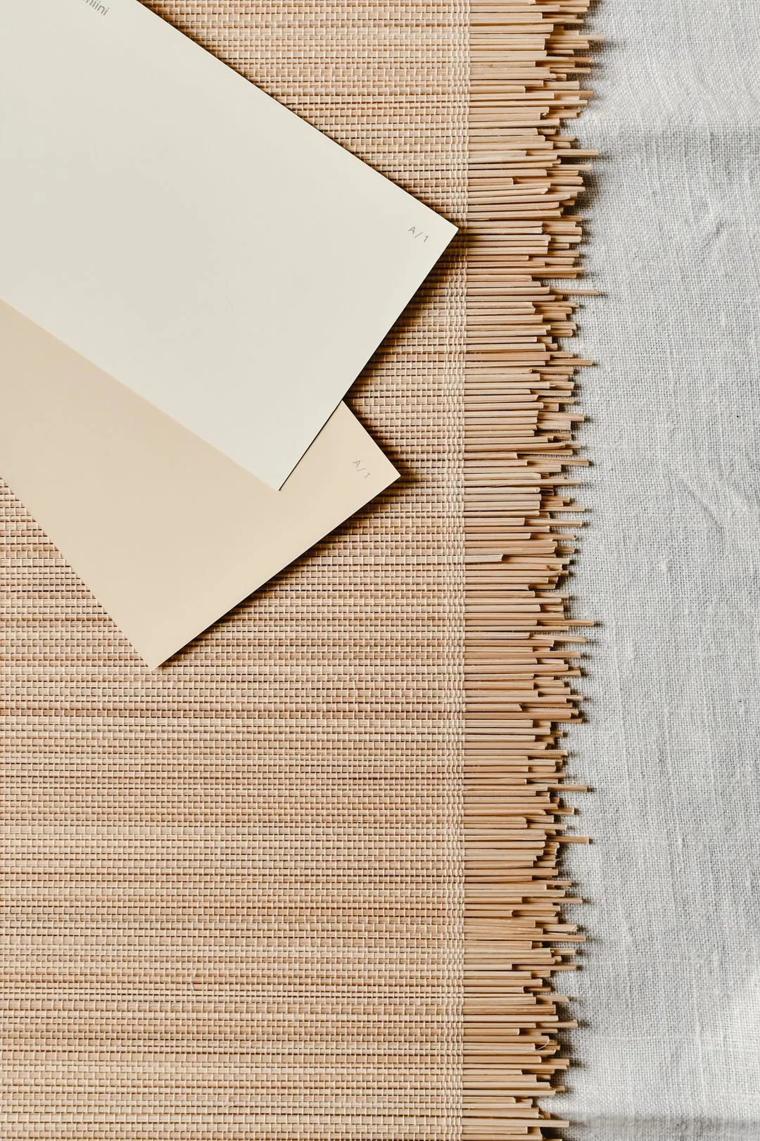 photo cards on bamboo mat aesthetic phone background