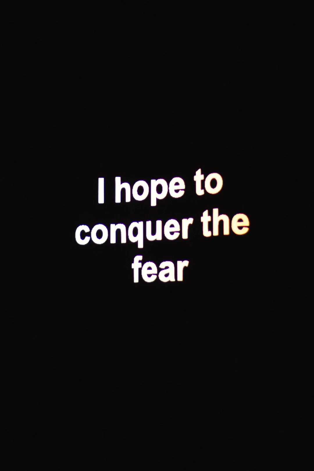 conquer the fear neon quote phone wallpaper aesthetic